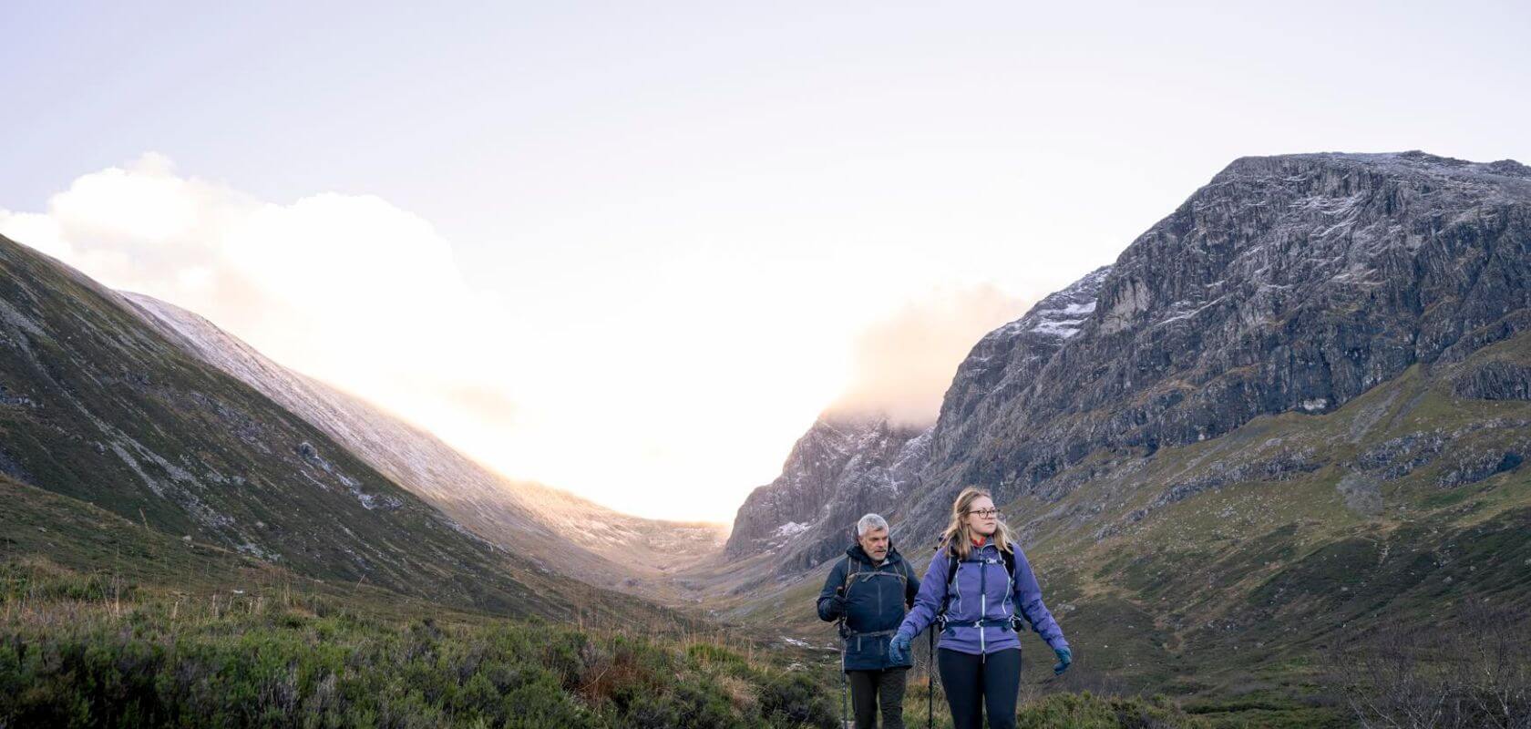 A man and women hiking in Scotland 