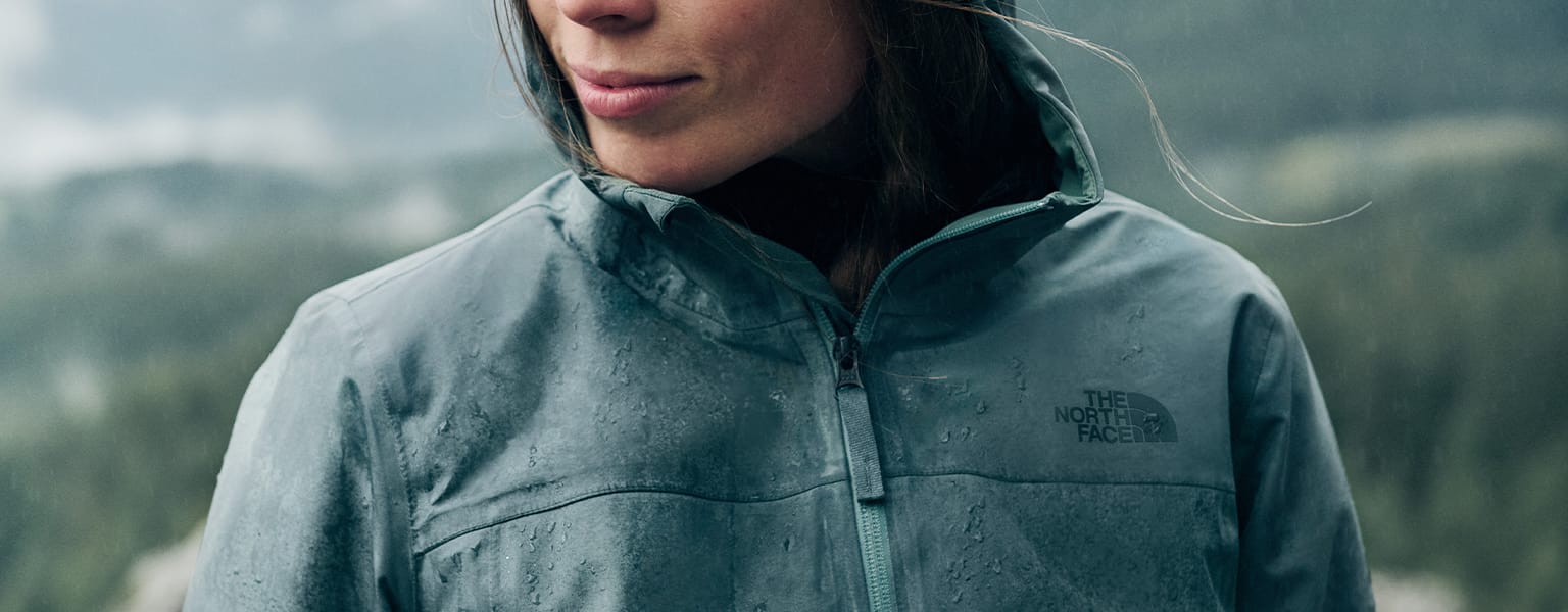 A woman wearing a waterproof TNF jacket