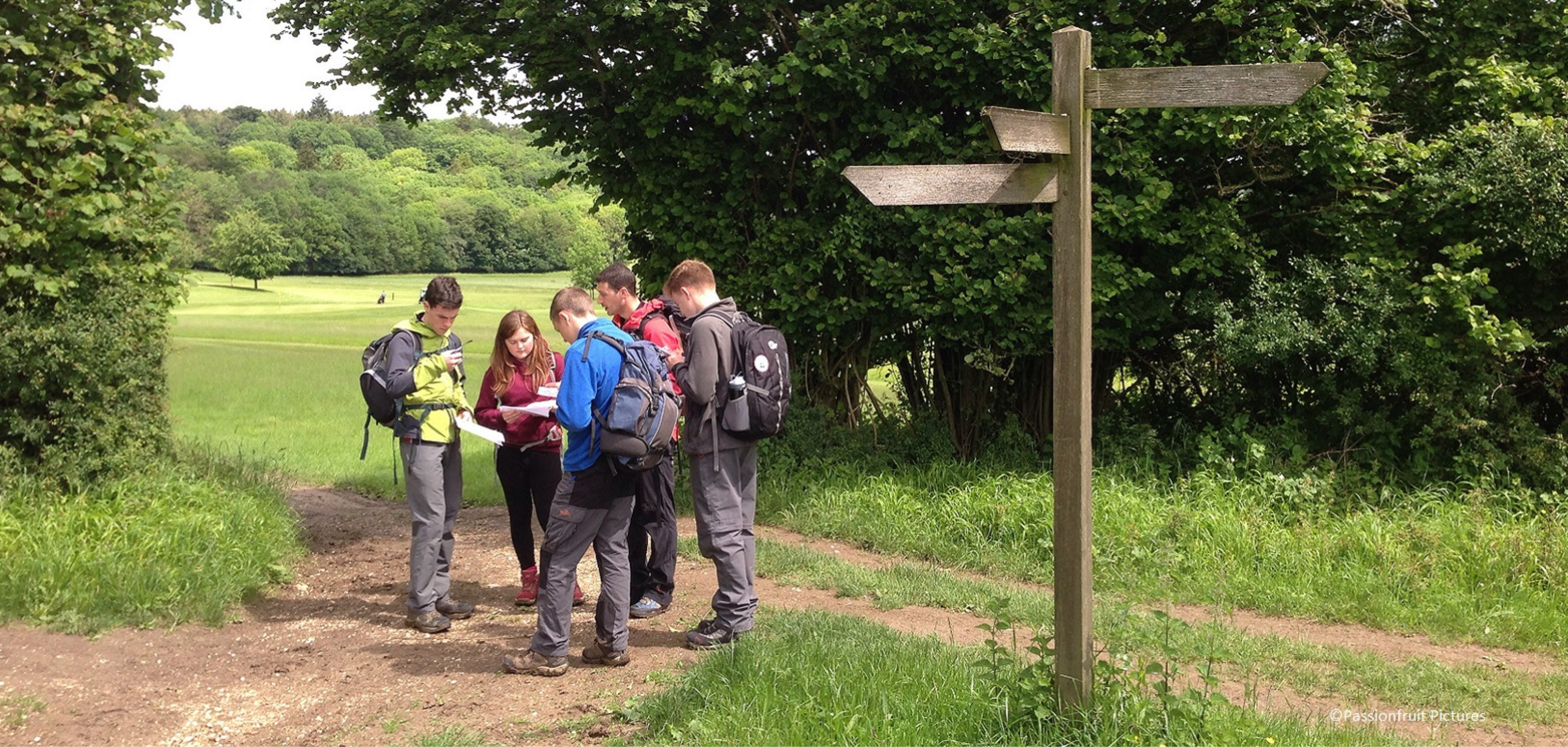 A group of people walking in the countryside