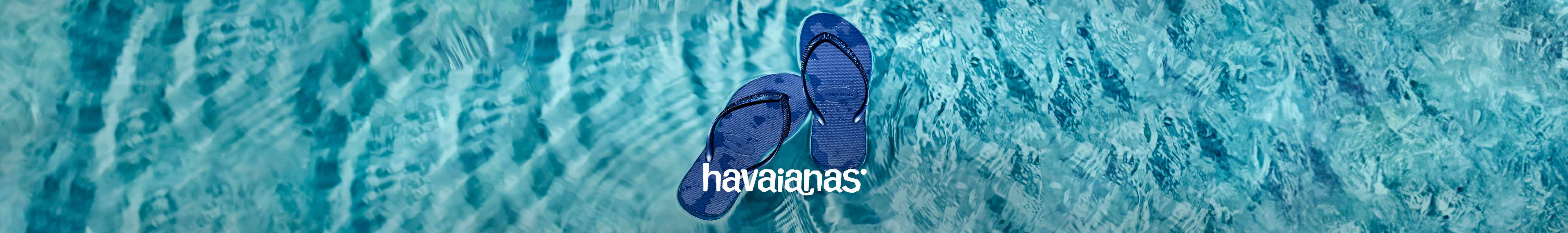 Sandals floating on a swimming pool