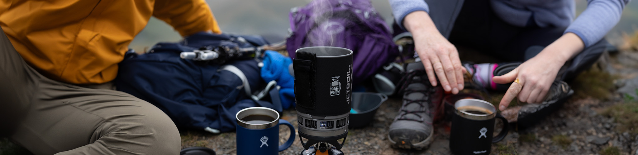 People cooking at a campsite 