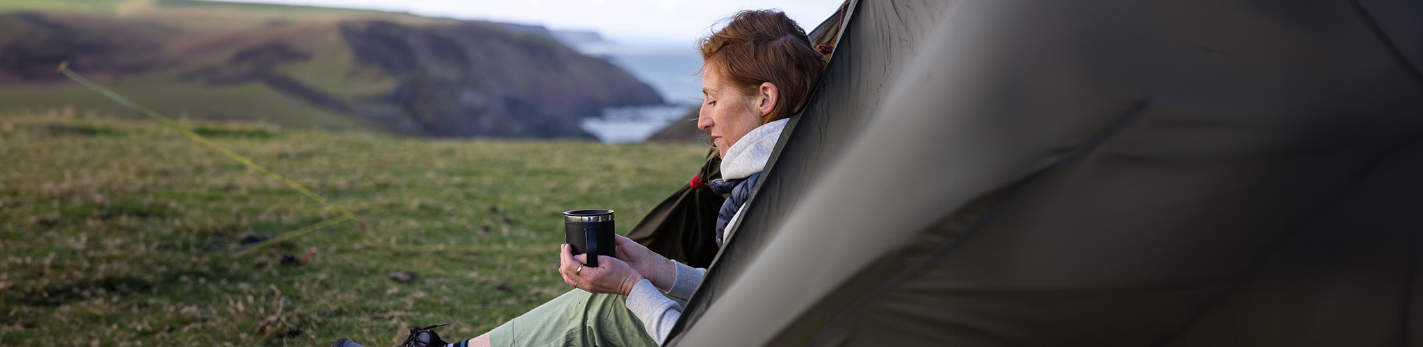 Woman sitting in a tent