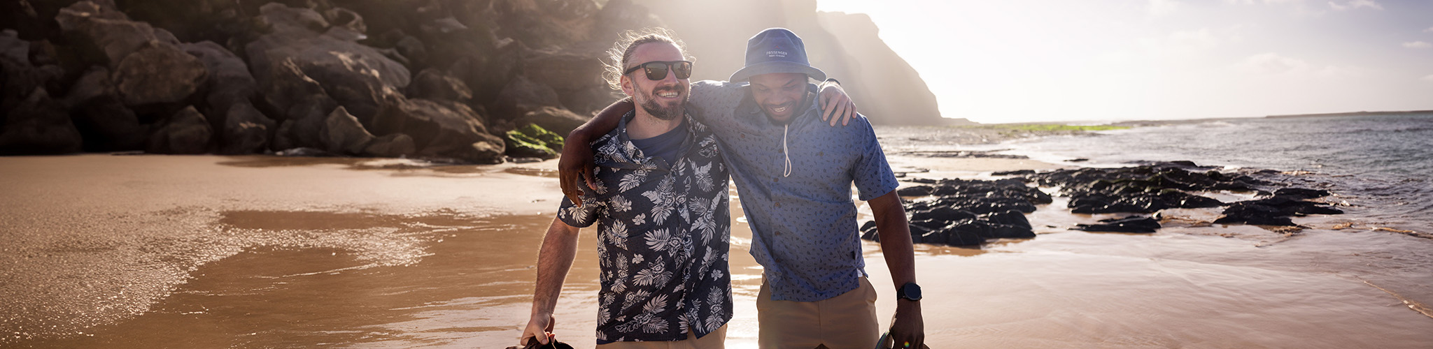 Men walking near the ocean