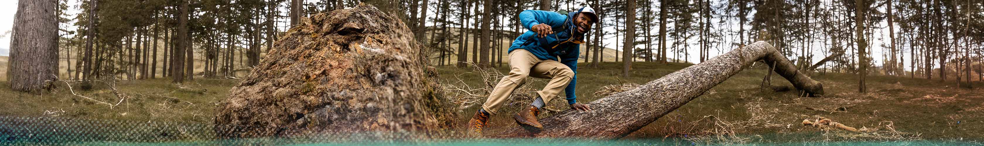 Man jumping over a tree