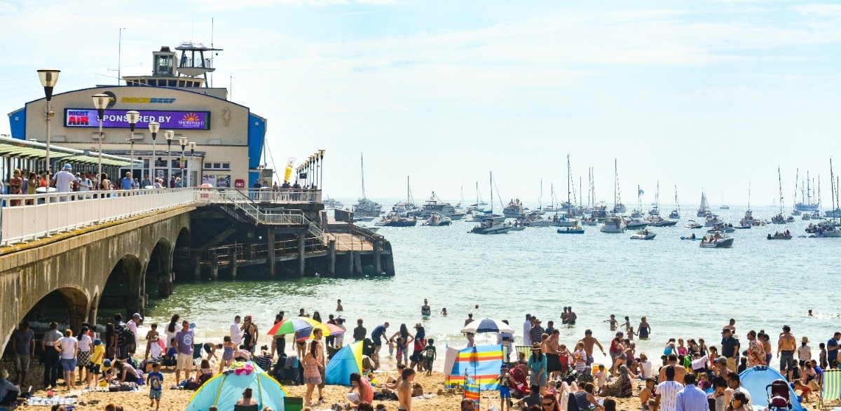 The busy beach by Bournemouth Pier 