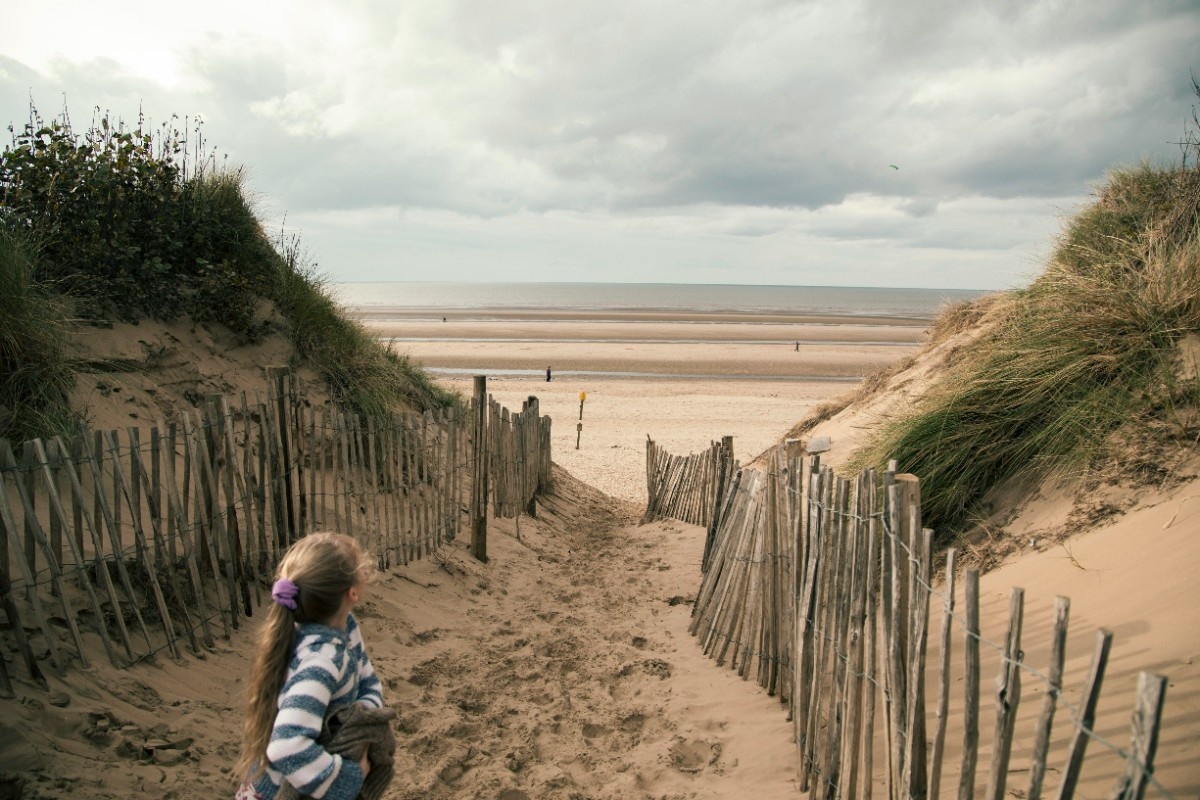 A child walking on Formby Beach