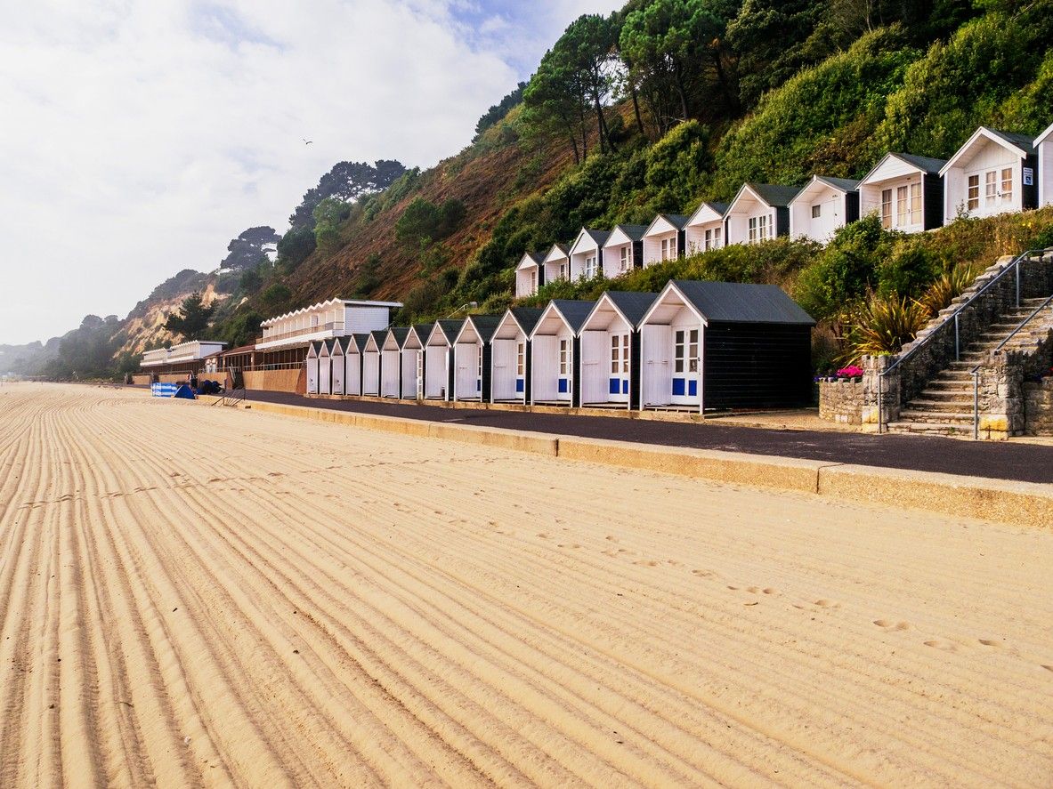 Beach huts along the sand at Sandbanks Beach in Dorset