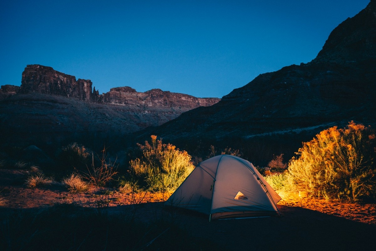 A backpacking tent at night 