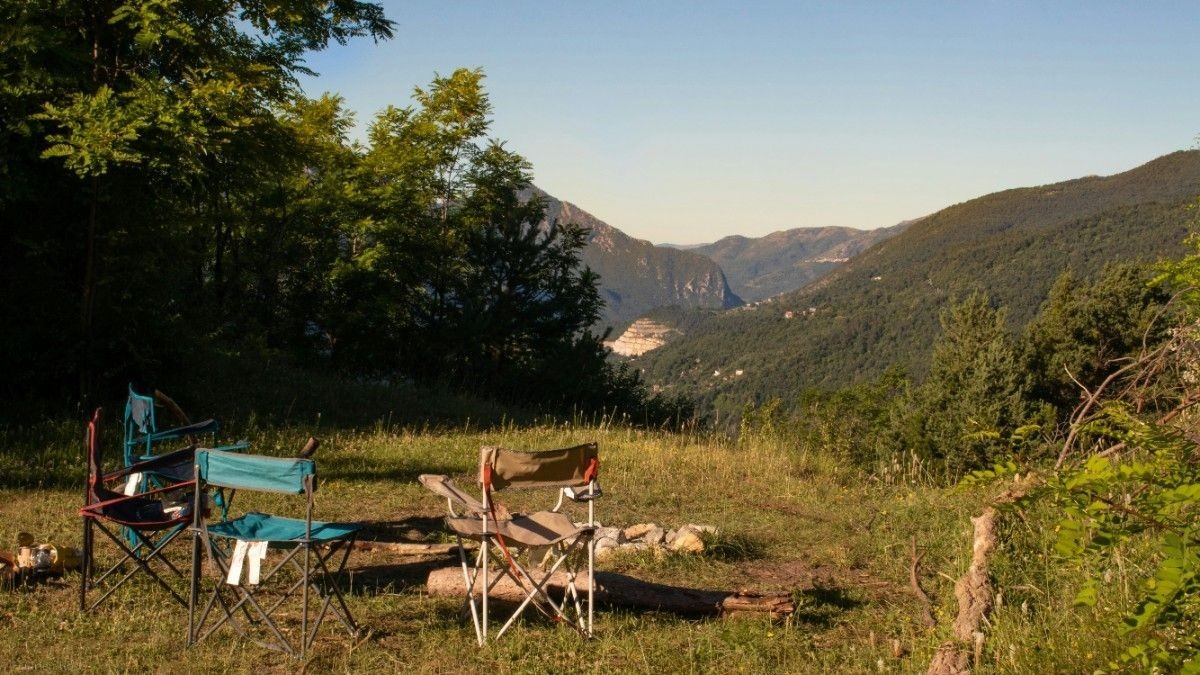 Camp chairs looking out onto luscious green landscape