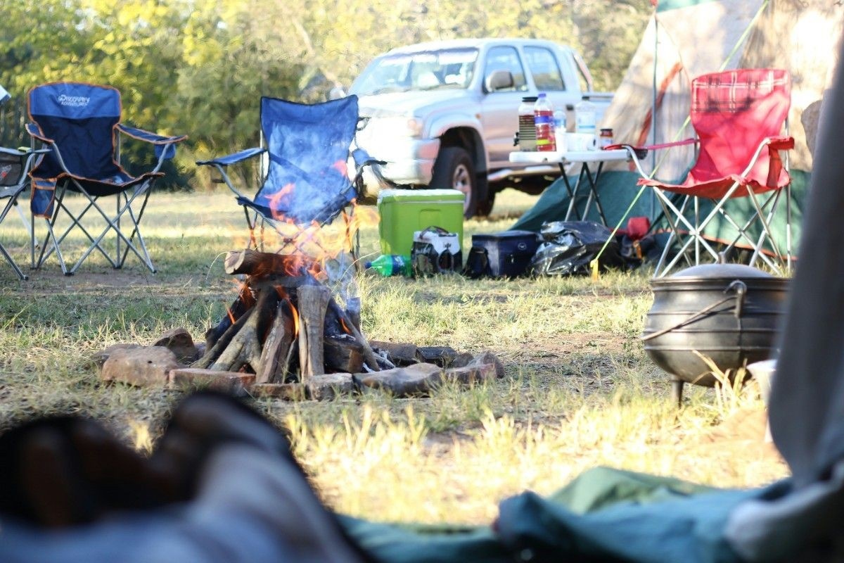 Camp chairs around the campfire