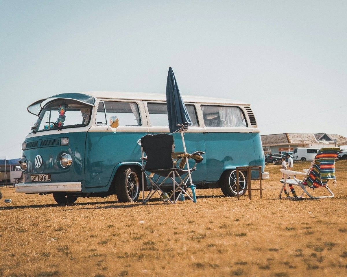 Camp chairs in front of a campervan 