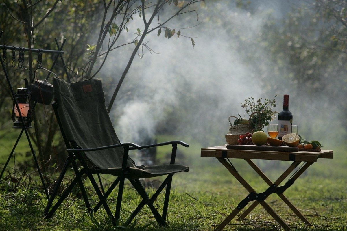 Camp chairs around a campfire