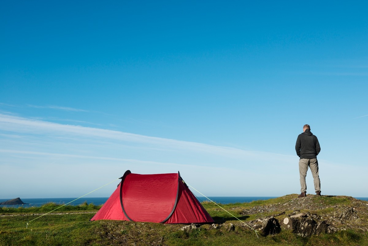 A man with his two man pop up tent 