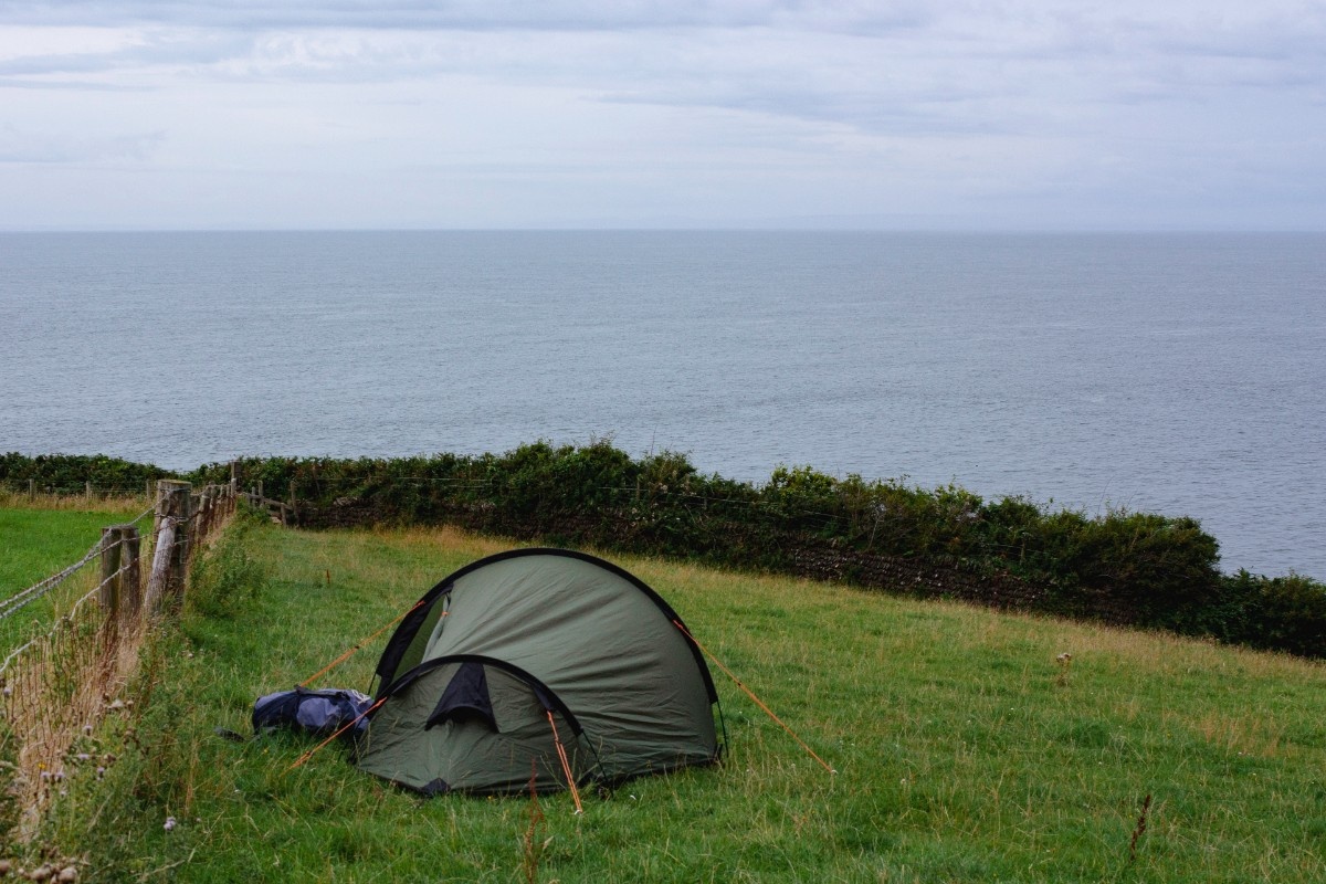 A tent wild camping on the Devon coast 