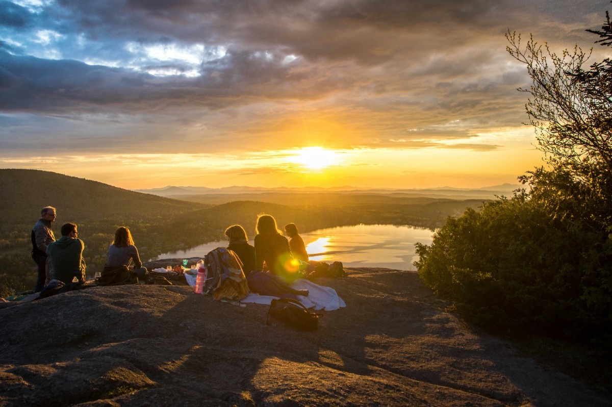 A family sat watching the sunset