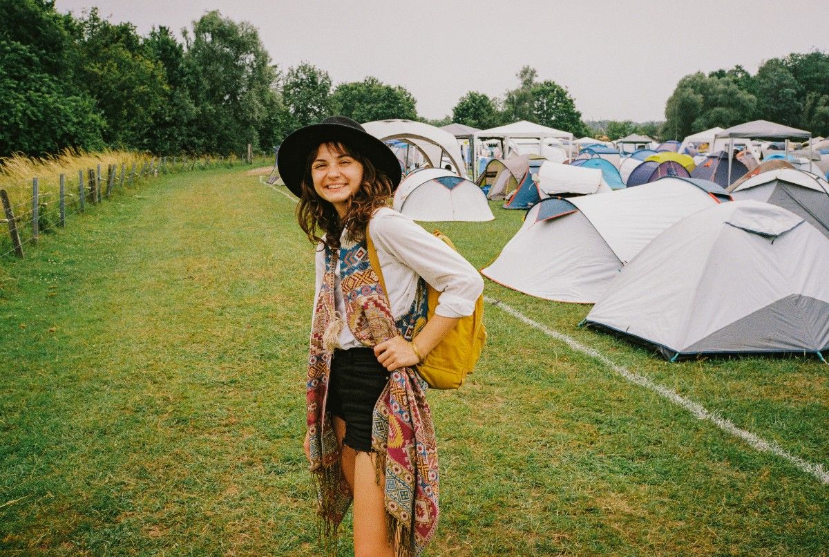 A woman at a festival campsite 