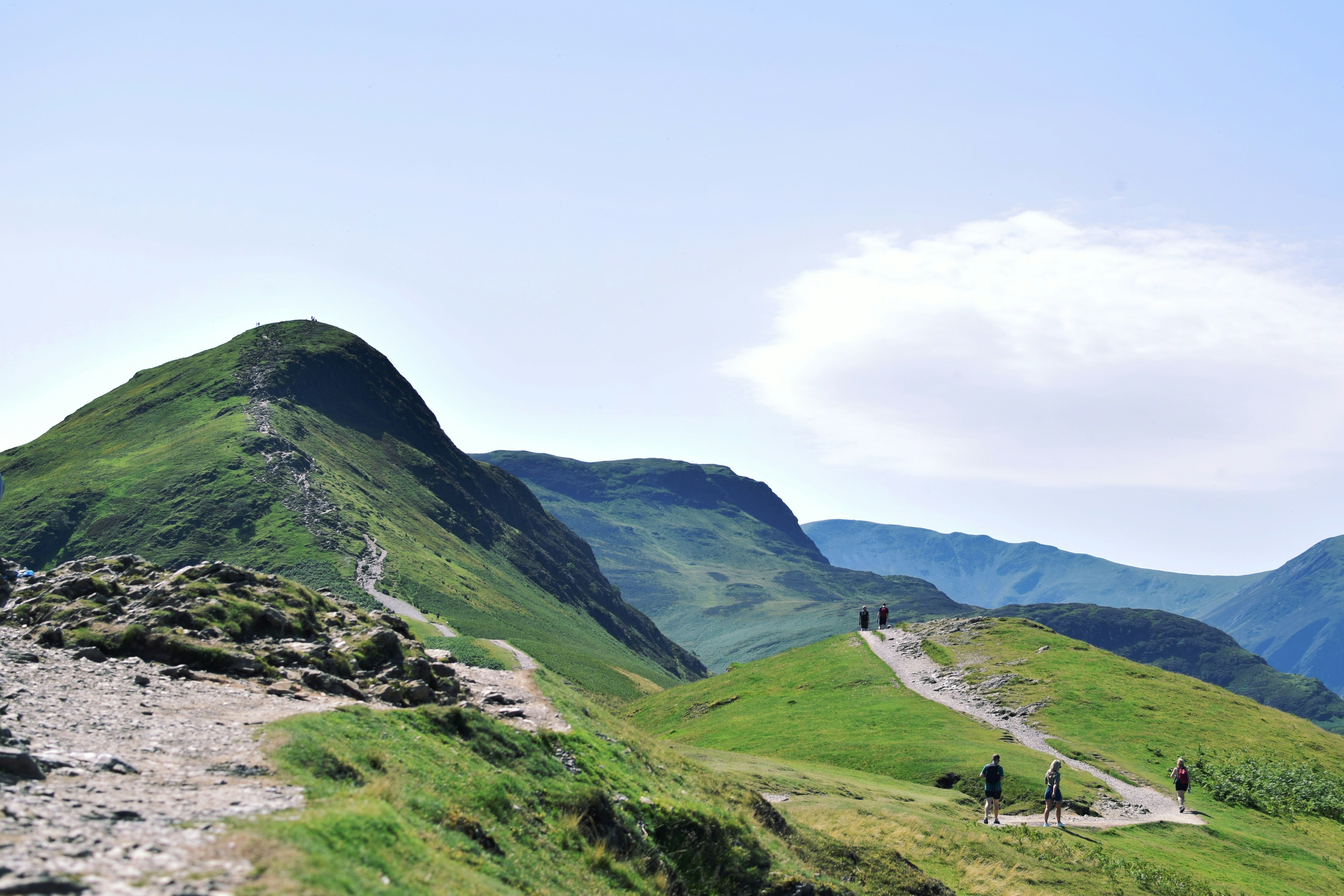 An image taken of a path through the Lake District's rolling hills