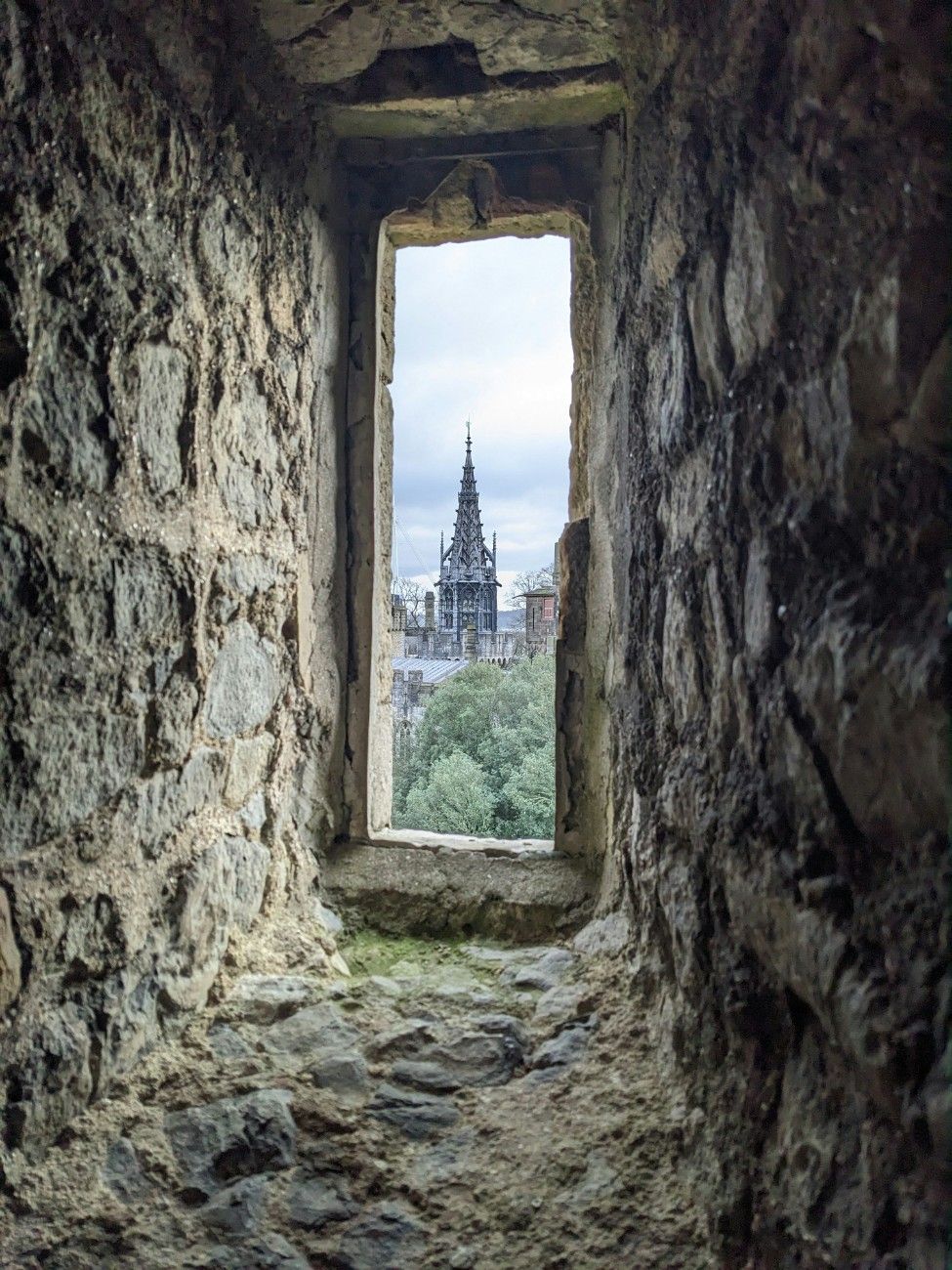 A church spire through a window in Cardiff Castle