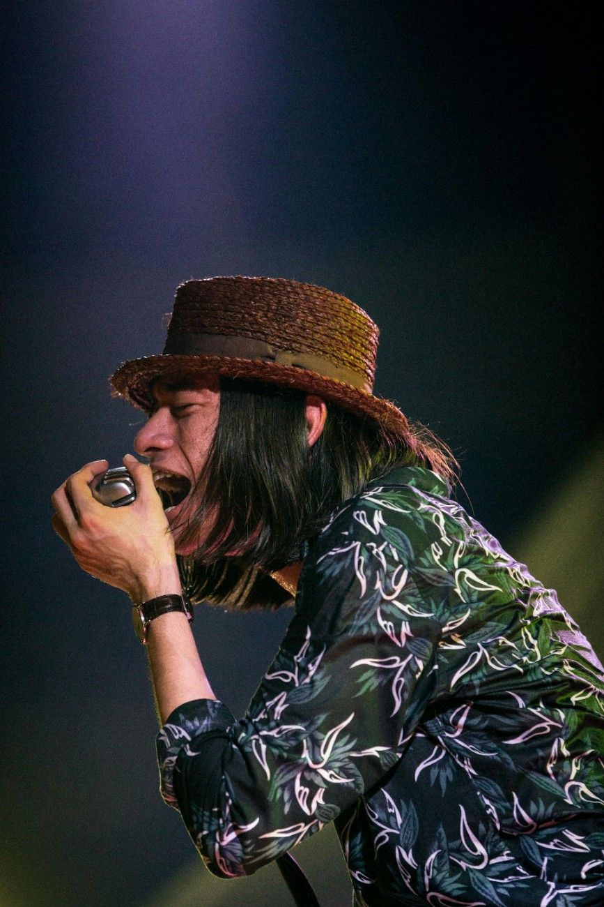 An Indonesian man singing on stage