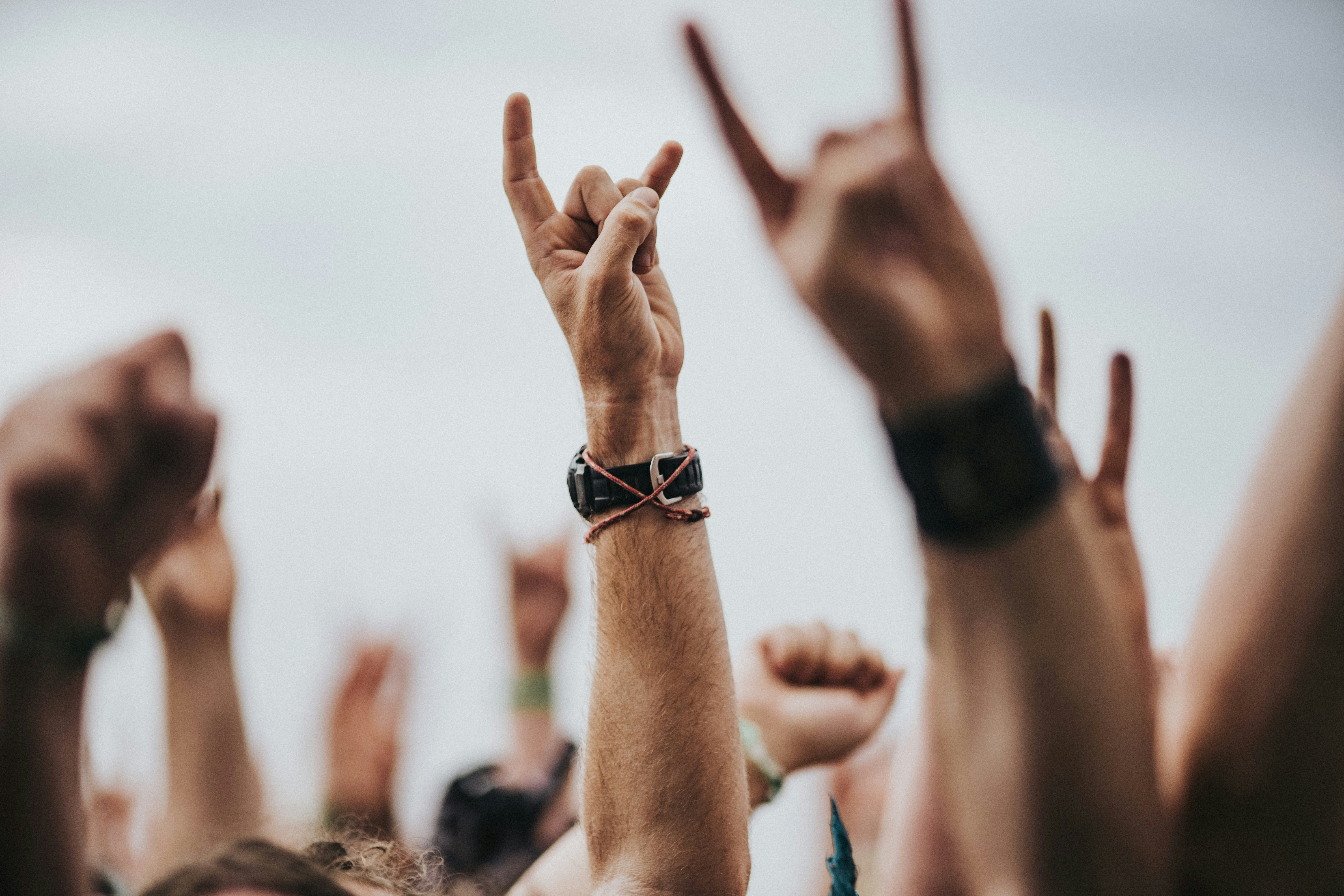 An image of a crowd at Download Festival, enjoying the music with their hands in the air 