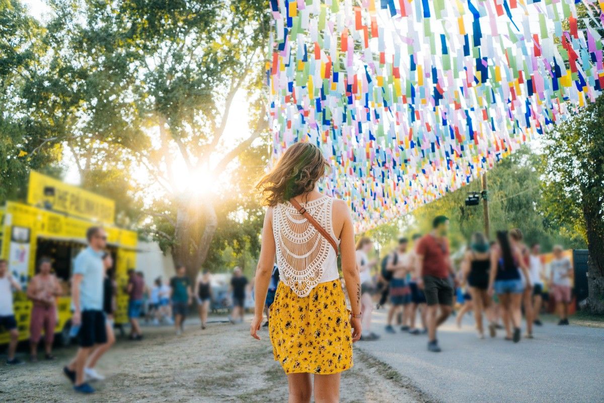 A woman walking through Sziget festival 