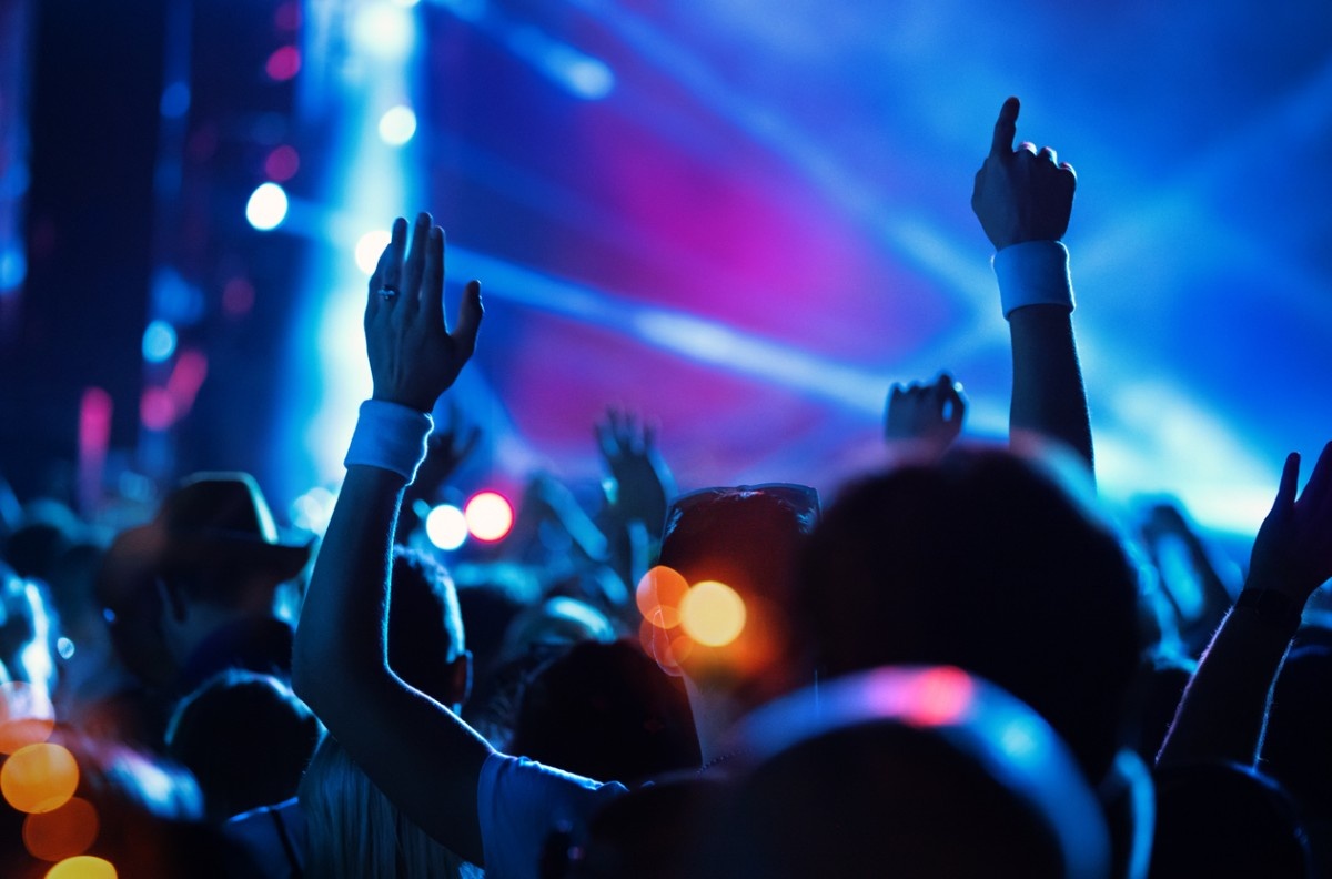 People dancing in a festival crowd