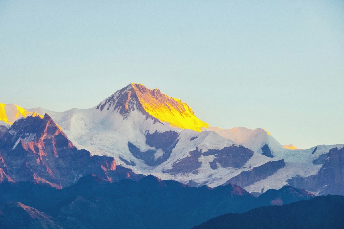 The sun rising on the mountains of the Annapurna Circuit