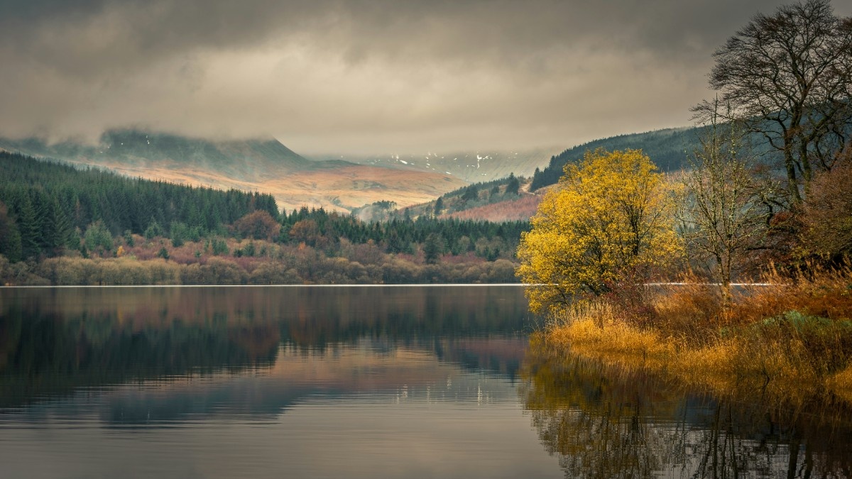 A lake surrounded by the hills and mountains of the beacons 