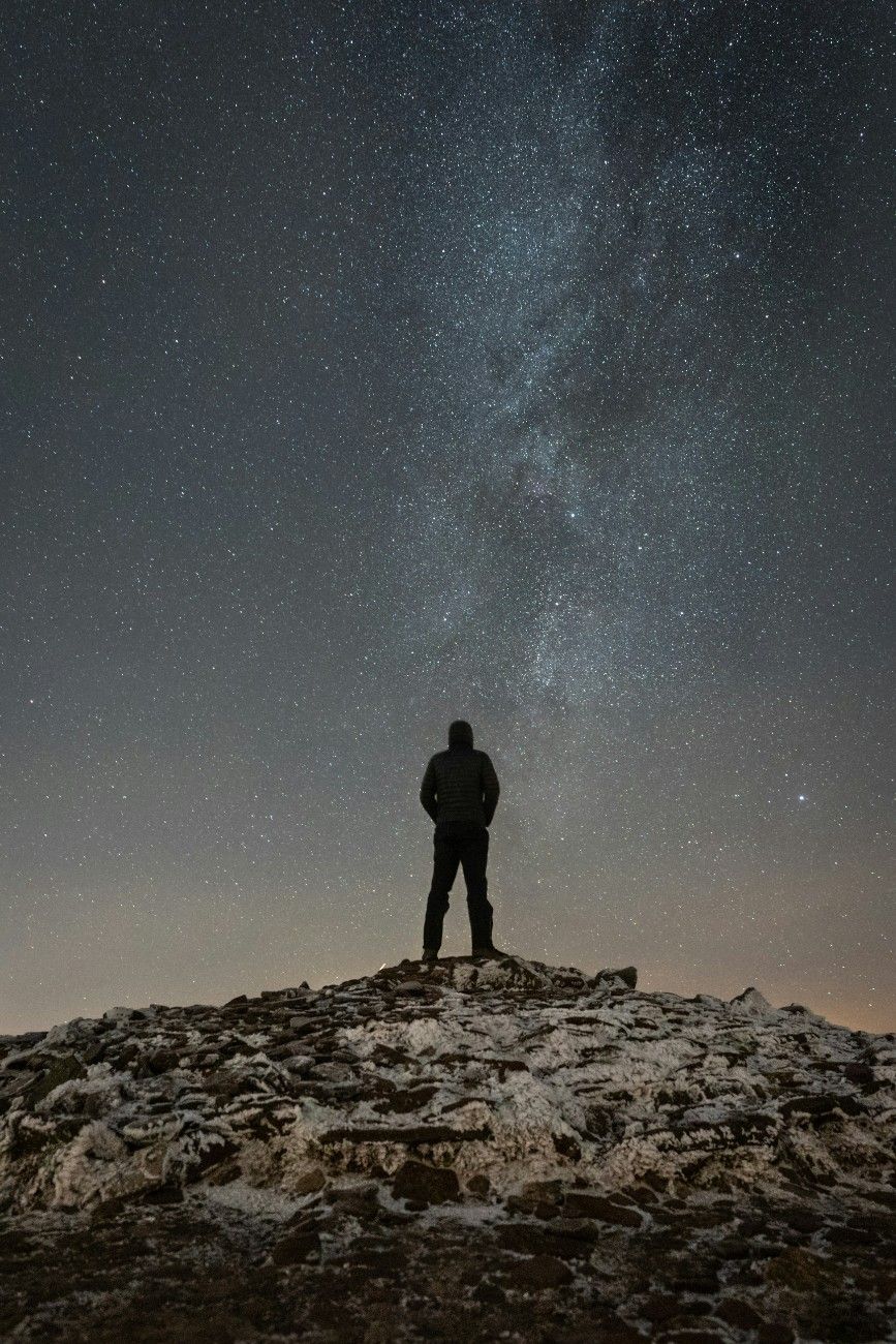 A man stargazing in Brecon Beacons