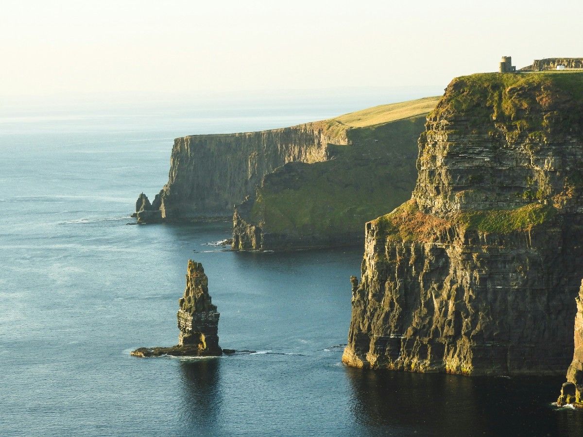 The Cliffs of Moher and a rock formation coming out of the sea 