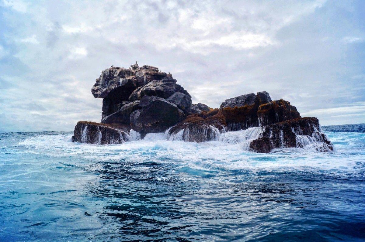 Waves crashing on the rocks of the Galapagos Islands