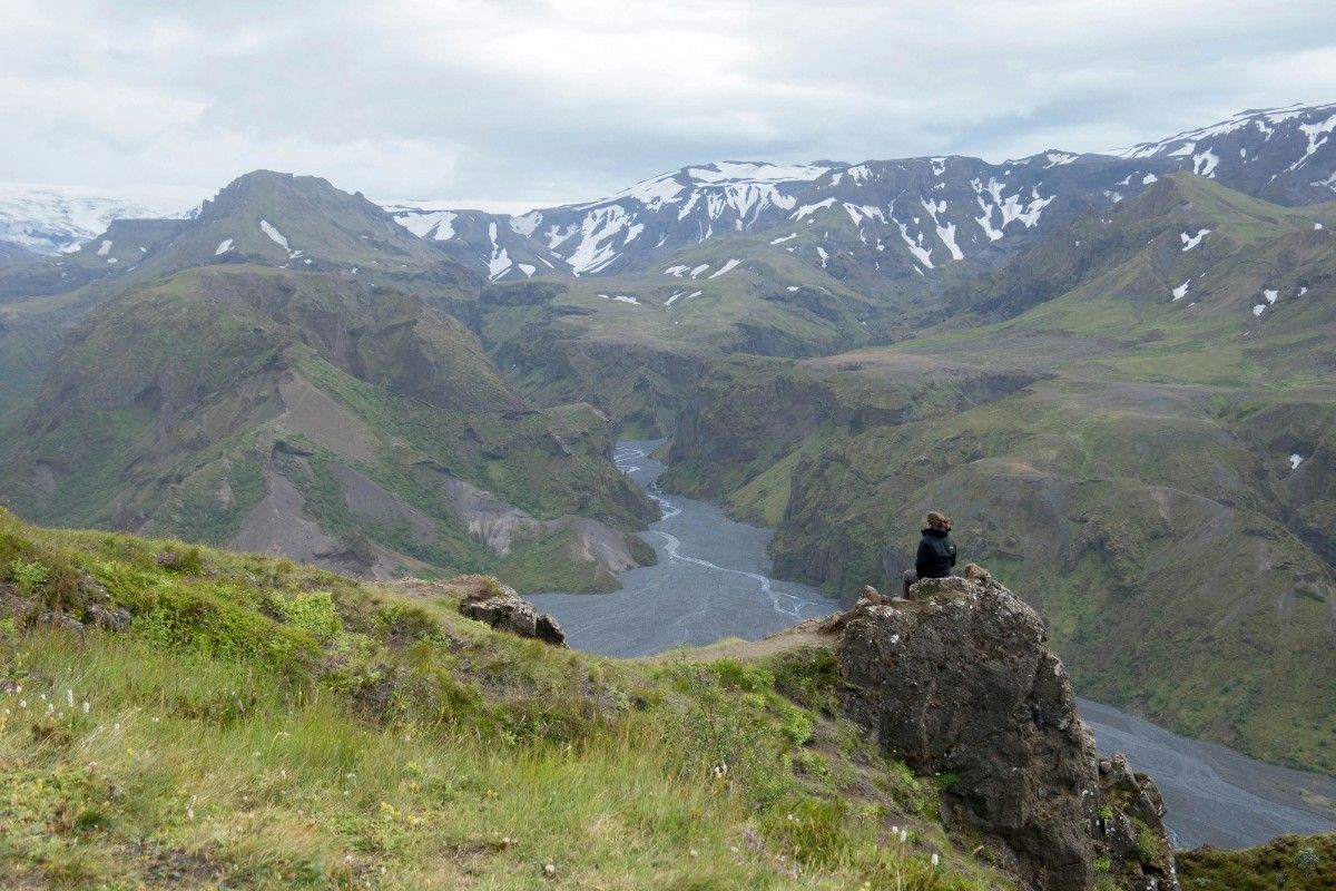 A person sat looking at the views of the Laugavegur Trail