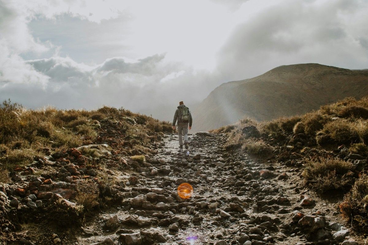 A man hiking the Tongariro Alpine Crossing