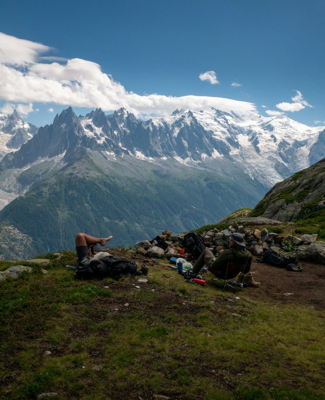 People lying down admiring the views of Tour du Mont Blanc