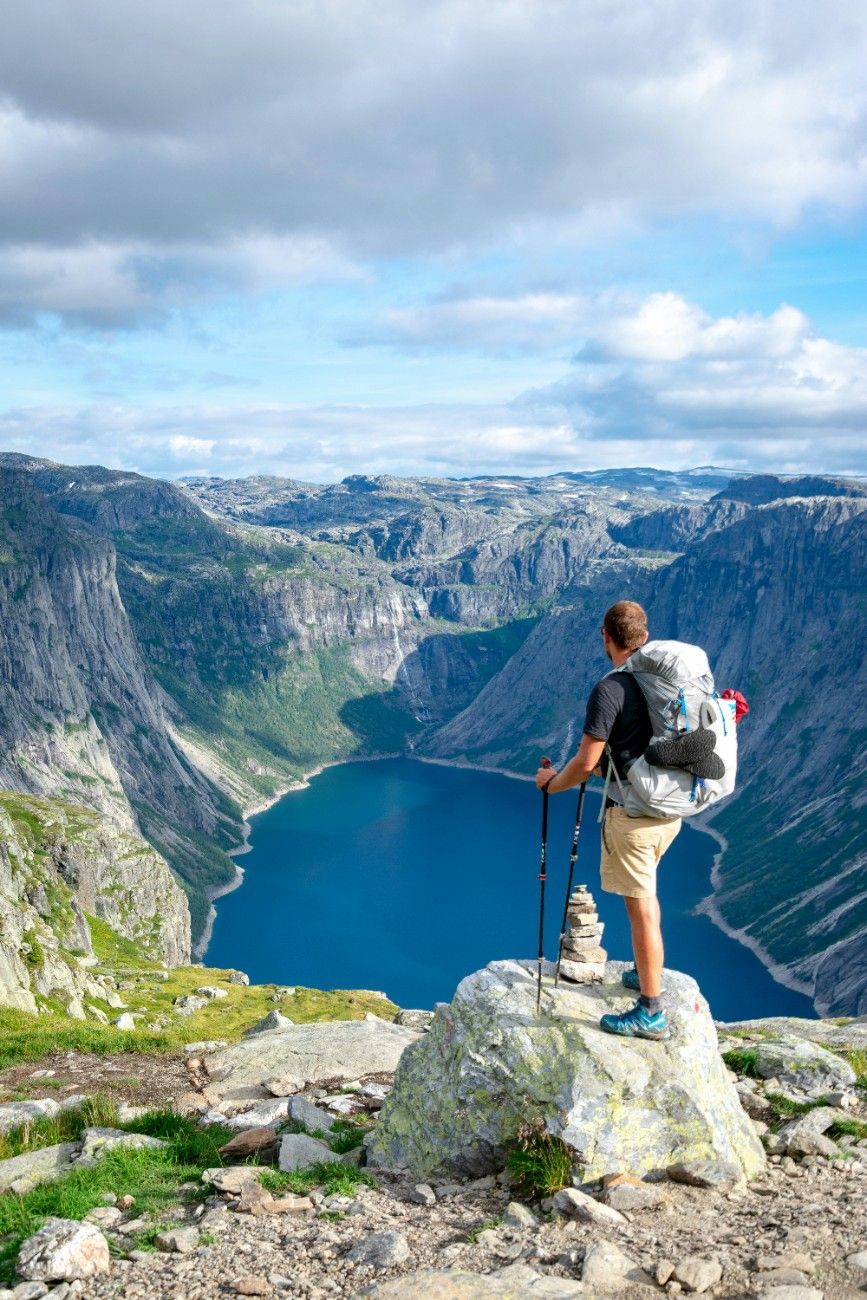 A person looking out at the lake at Trolltunga