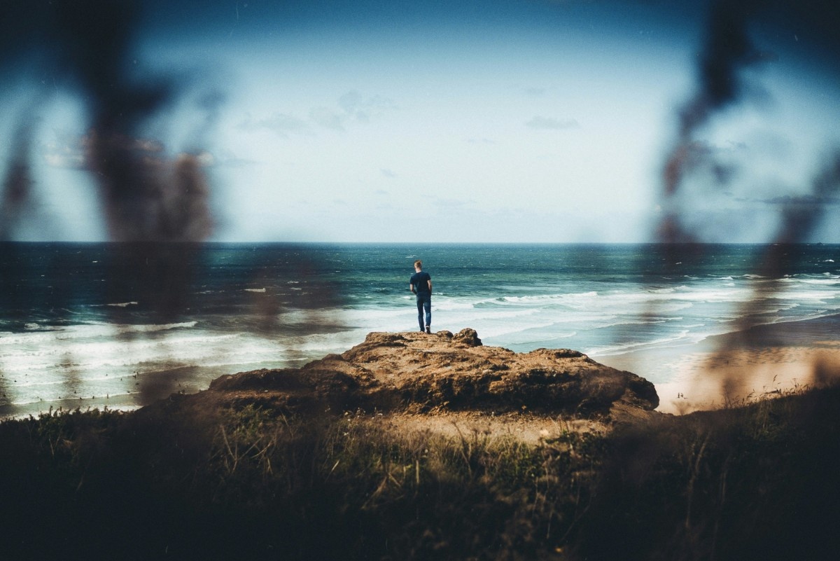 A person looking out at Watergate Bay