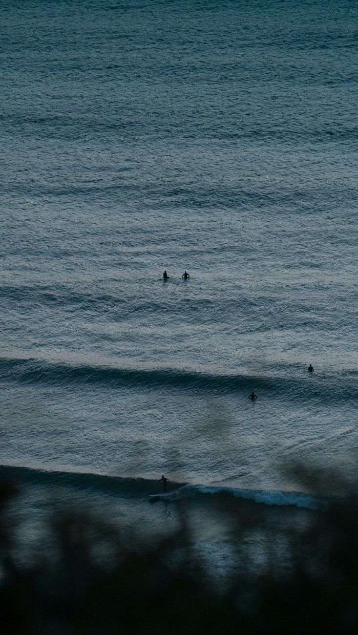 People in the sea at Watergate Bay