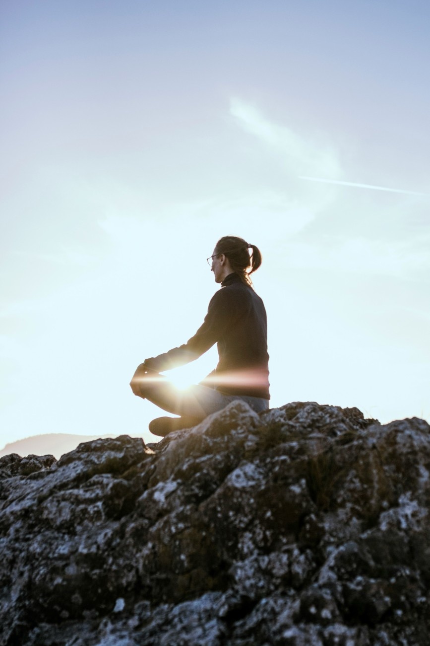 A woman meditating in nature