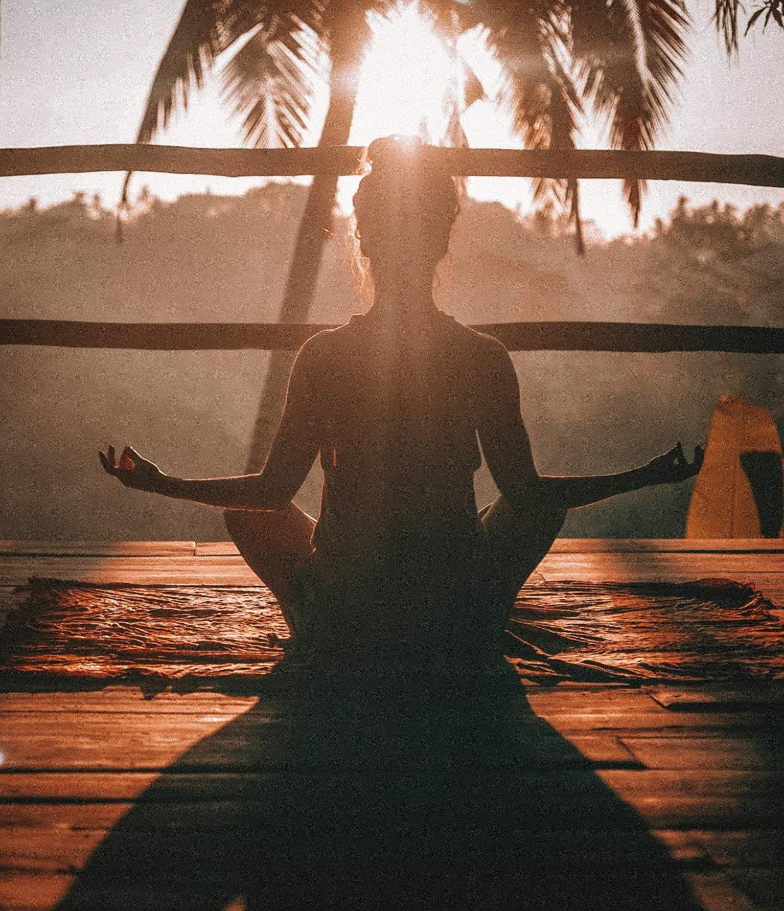 A woman meditating outside 