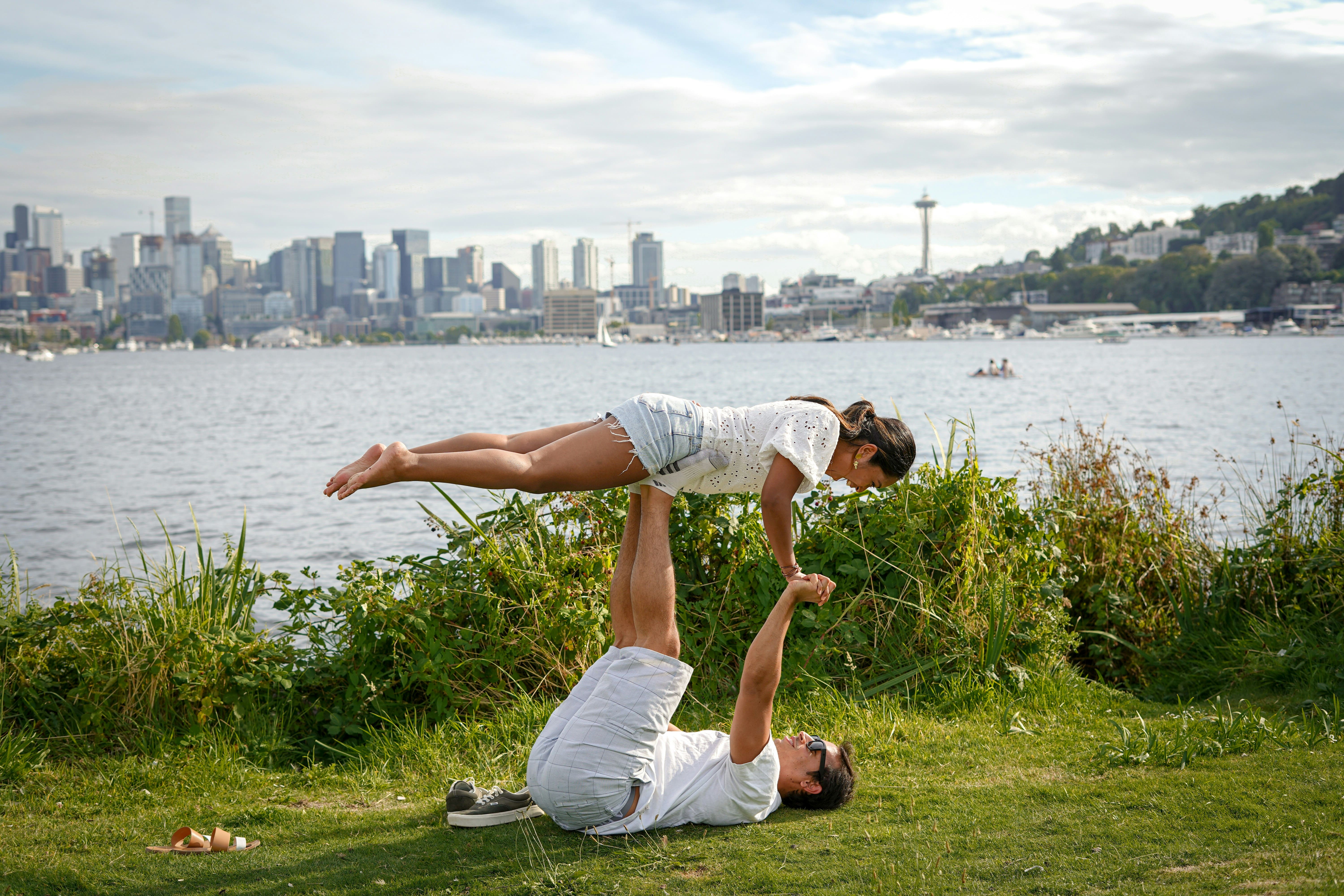 Two people performing a yoga balance 