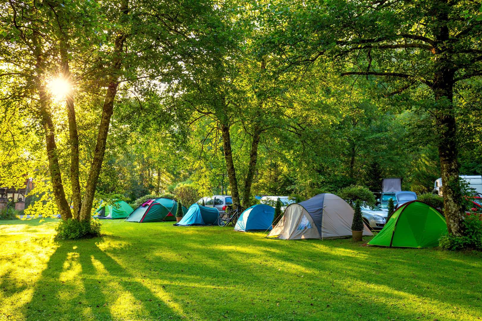 A woman and a man are pitching a tent