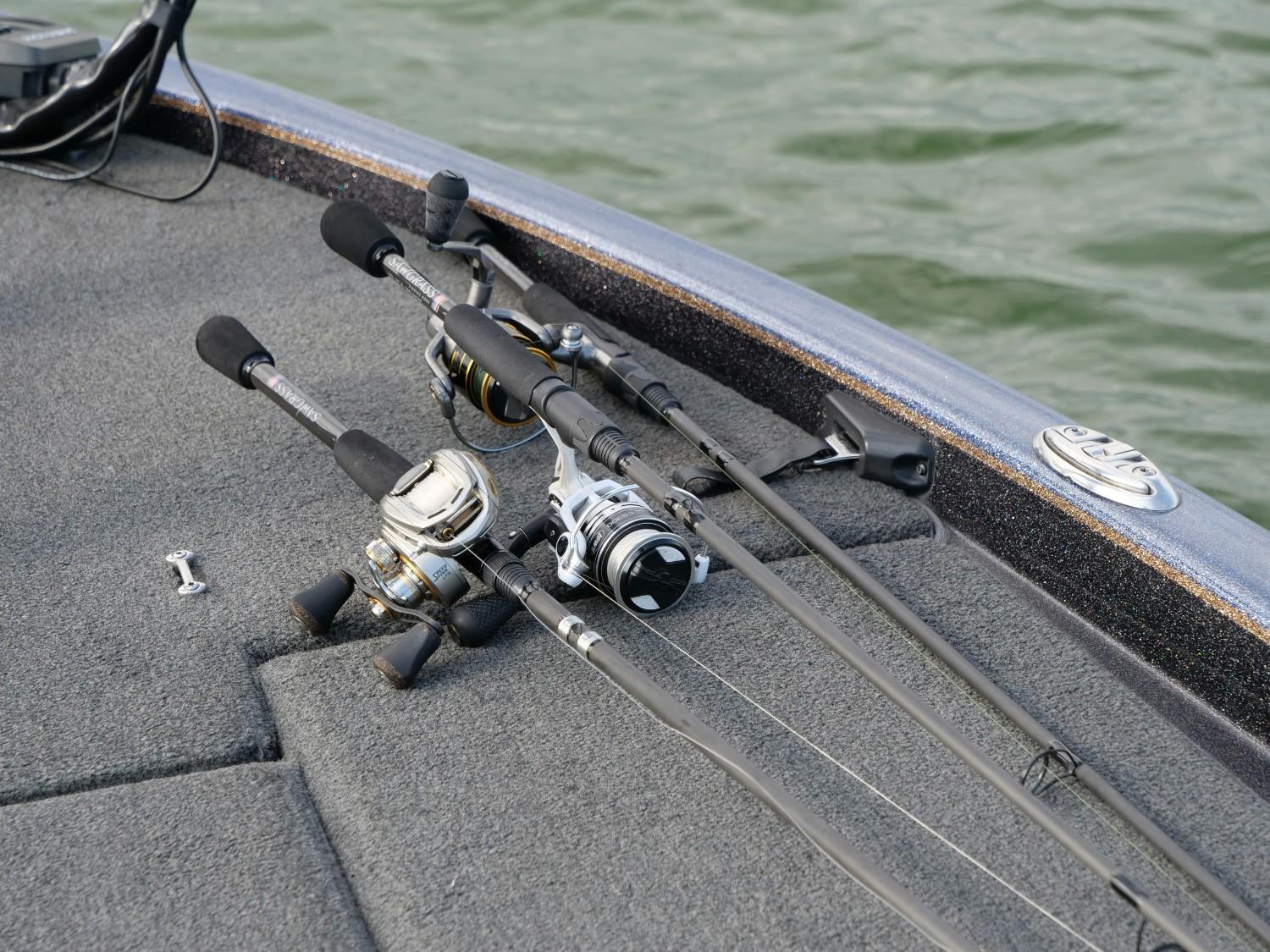 fishing rods and reels on a boat in the water