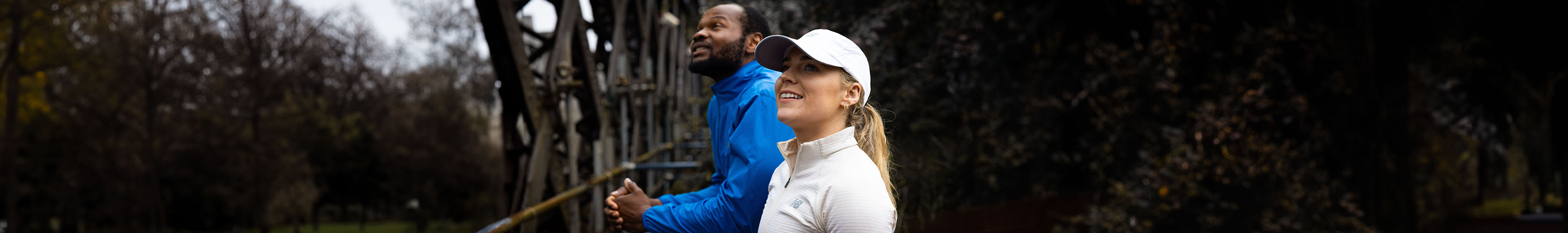 Shop Runners Need clothing. Man and woman standing on the street