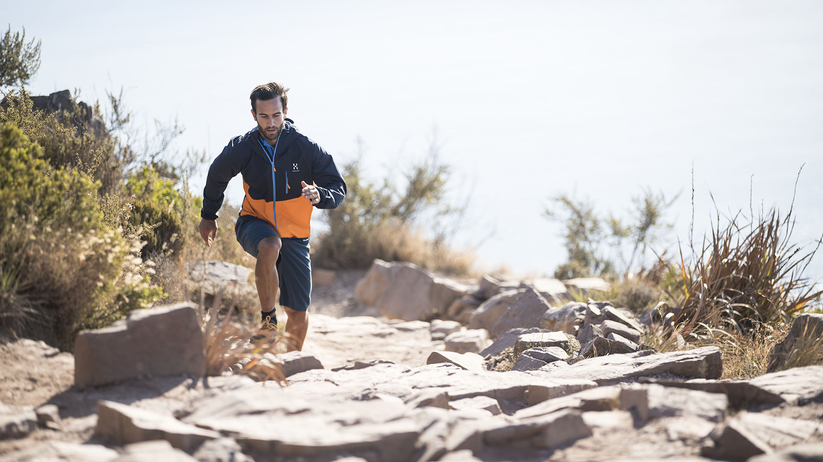 A person on a run in a waterproof jacket 