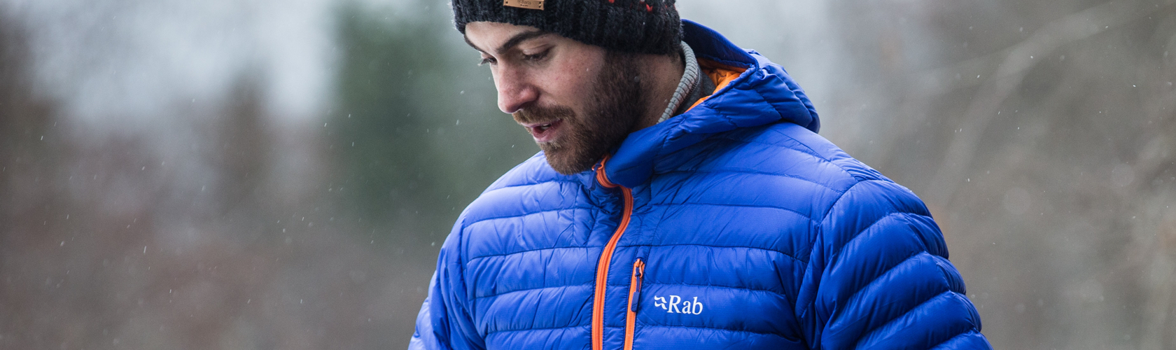 Down Insulation - Man wearing a blue Rab jacket